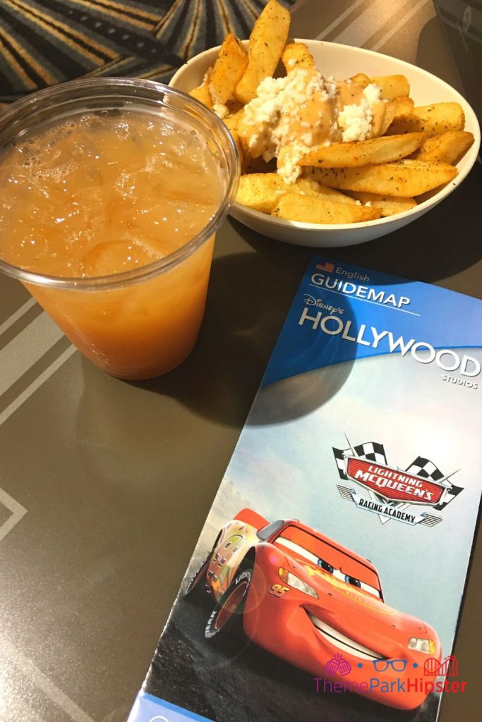 ABC Commissary Hollywood Fries with gravy and cheese and orange adult cocktail Happy Daze and Southwestern Steak Fries