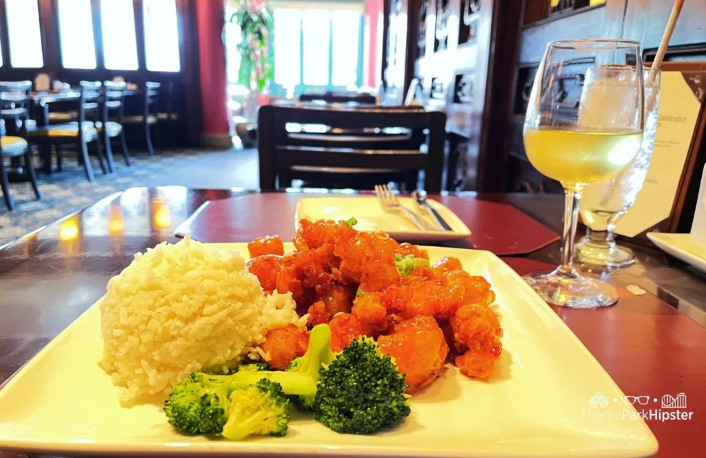 Epcot Wine with Orange Chicken in China Pavilion at Nine Dragons Restaurant. One of the best Restaurants at Epcot.